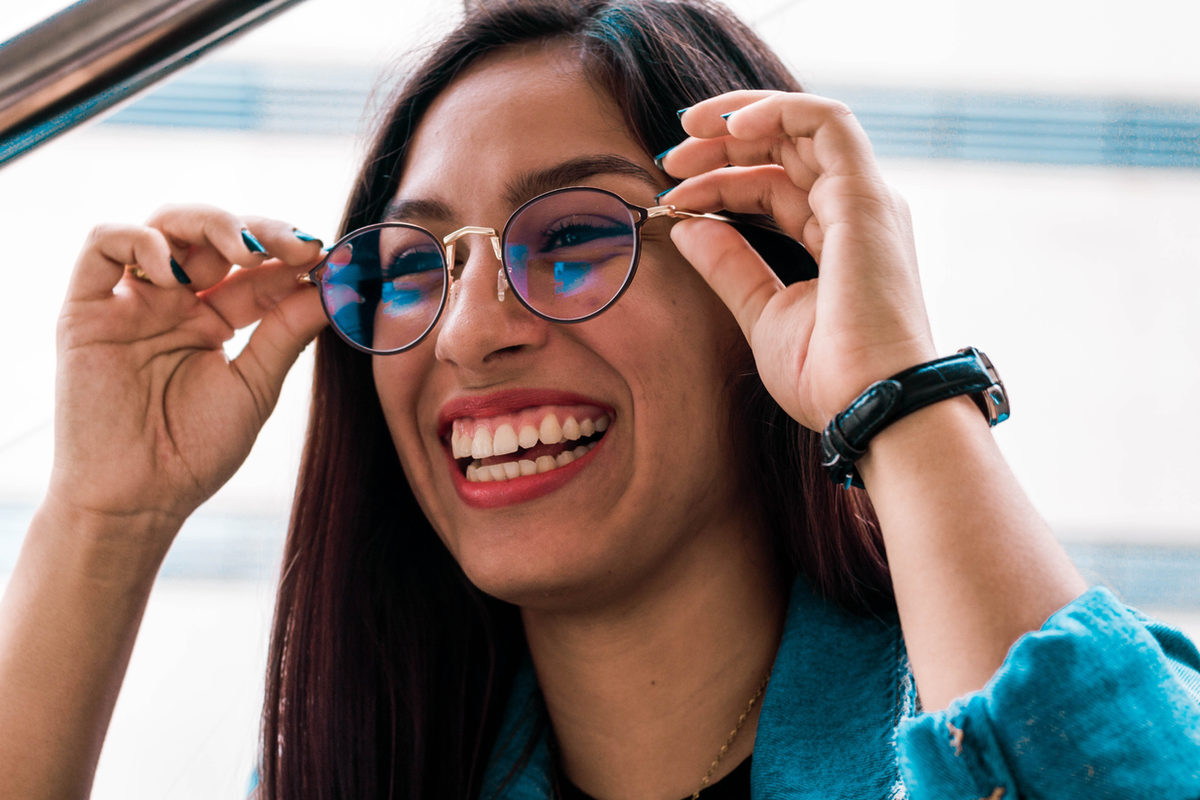 Woman trying on glasses